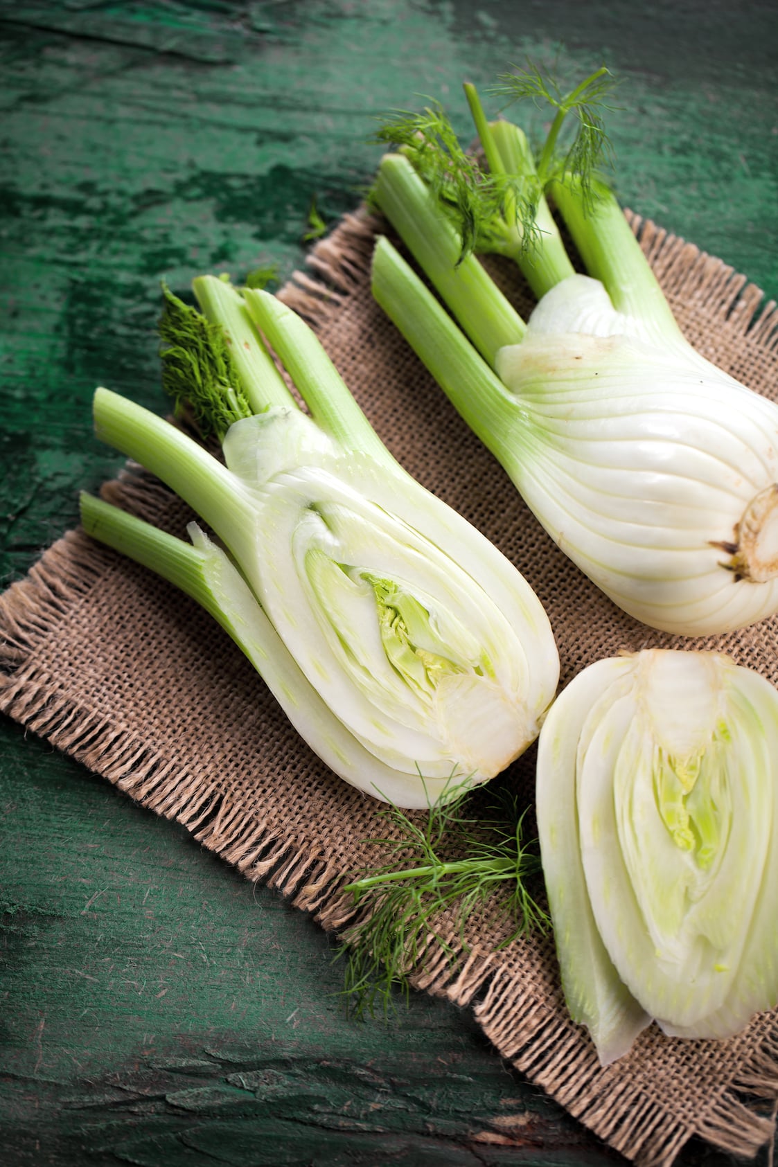 Fresh Fennel bulbs on a wooden background