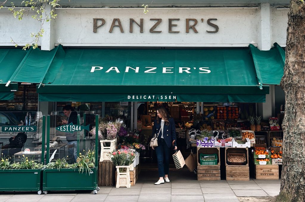 A woman exits the shop outside Panzer's Deli in London