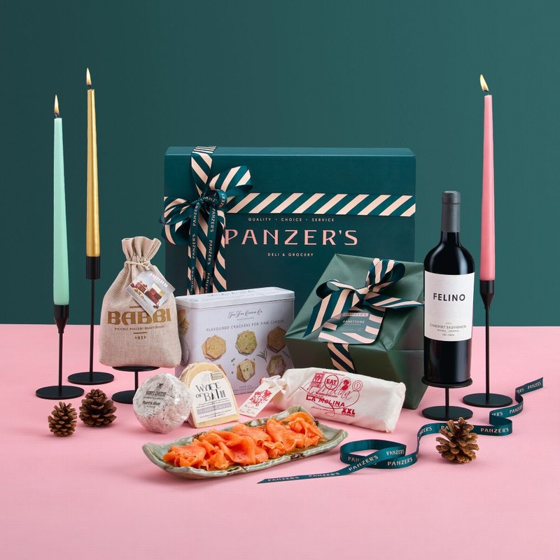 Christmas Connoisseur hamper with premium wines, artisanal foods, and festive delicacies, presented in a luxurious gift box with Panzer’s ribbon.