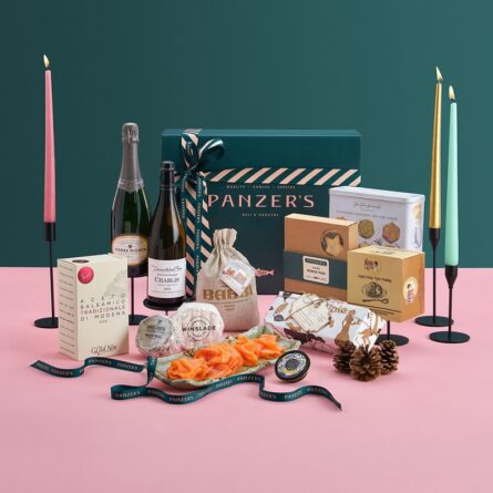 Splendid Christmas hamper with a curated selection of festive gourmet foods, wines, and seasonal treats, presented in a luxurious gift box with Panzer’s ribbon.